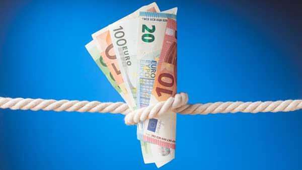 Inflation Geld in der Mangel - ein Zeichen der Inflation